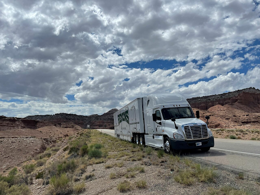 Truck driving in the desert.