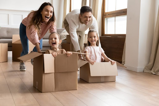 Family playing with boxes.