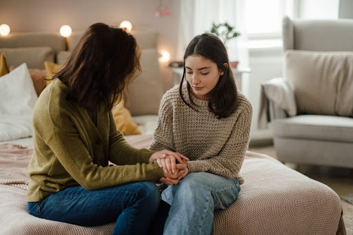 Mom and daughter talking.