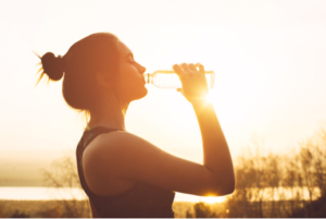 Woman drinking water.