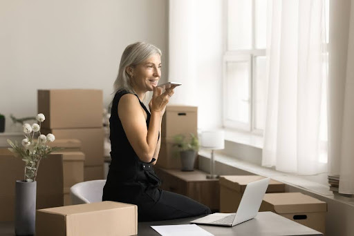 Woman surrounded by boxes.