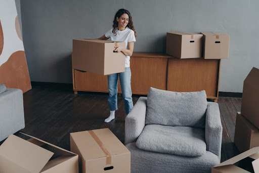 Woman moving boxes.