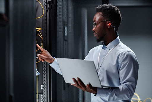 Man holding a computer.