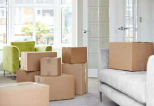 A pile of boxes in a living room.