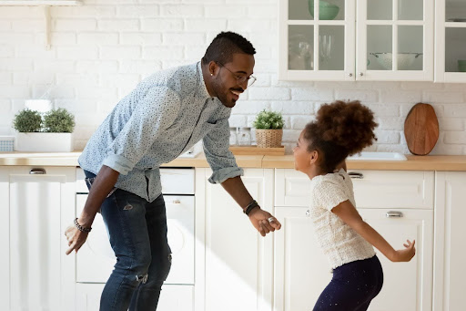 father-and-daughter-dancing-kitchen