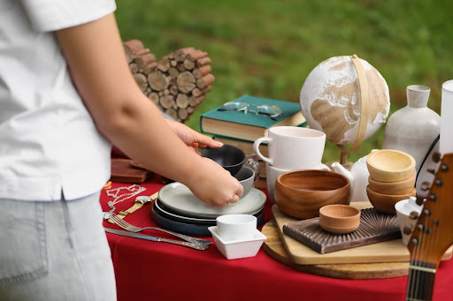 Person putting items on a table.